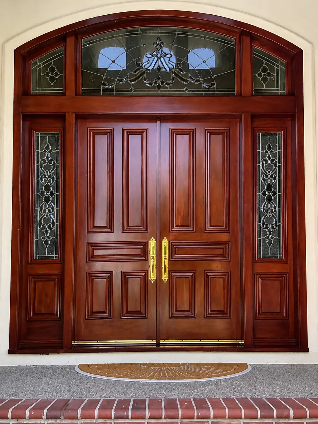 Custom mahogany double entry doors with leaded glass